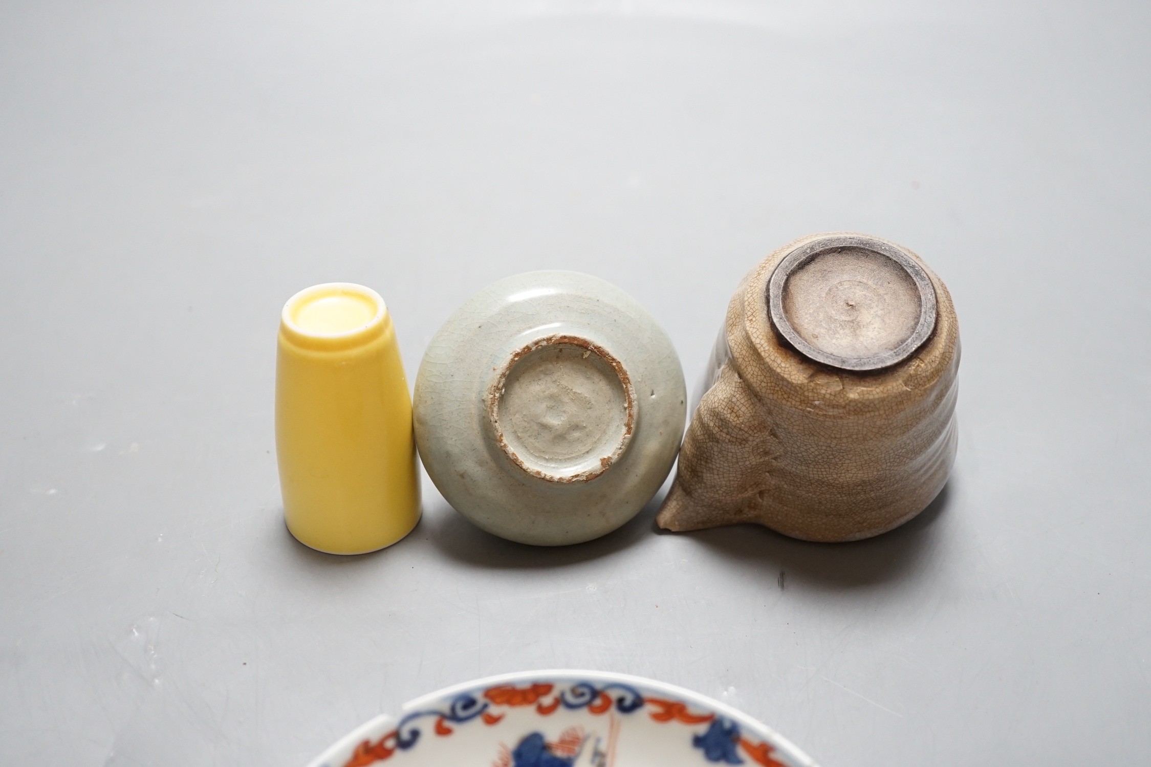 An 18th century Chinese Imari pattern saucer, a small Korean vase and two other pieces